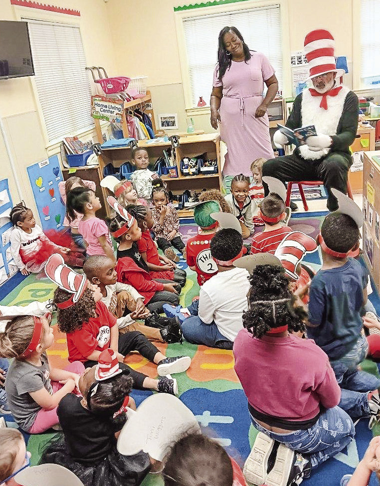 Jones County Commission Chairman Chris Weidner reads to children at Jones Head Start dressed as Cat in the Hat. CONTRIBUTED