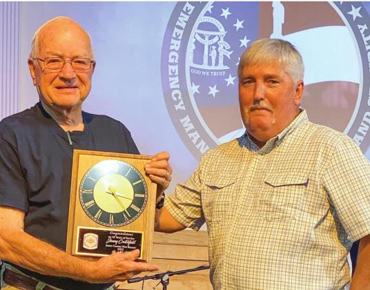 Jones County firefighter Jimmy Crutchfield (left) is presented his 45-year service award by Chief Don Graham.